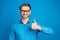 Photo of young man happy positive smile show thumb-up like perfect fine ad promo isolated over blue color background