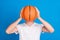 Photo of young man hold hands basketball game play cover close face isolated on pastel blue color background