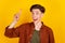 Photo of young man point finger have excellent solution plan smart  over yellow color background