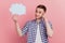 Photo of young man think deeep creative doubt hold paper cloud speech dialog isolated over pastel color background