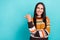 Photo of young positive attractive girl striped orange sweater look point finger mockup enjoy brand discount offer