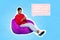 Photo of young positive modern smartphone user girl sitting beanbag relaxed reading message chatterbox isolated on