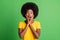 Photo of young shocked amazed surprised afro girl hold hands cheeks hear unexpected news isolated on green color