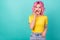 Photo of young sweet pink hairstyle lady tell secret wear yellow t-shirt isolated on teal color background