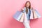 Photo of young teen age schoolgirl kid hold stack packages shopping center look empty space best choice discount