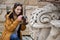 Photo of young tourist girl exploring streets of Baku. Moody photos of teenager girl visiting old city and taking photos