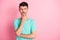 Photo of young unhappy sad unsure thoughtful clever man thinking look copyspace isolated on pink color background