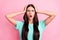 Photo of young unhappy upset shocked amazed surprised girl hear bad news isolated on pink color background