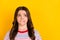 Photo of young unhappy upset stressed worried girl looking copyspace bite lips  on yellow color background