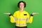 Photo of young woman firefighter happy positive smile hold hands solution product advert pros cons isolated over green