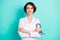 Photo of young woman happy positive smile crossed hands hold stethoscope doctor isolated over teal color background