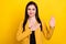 Photo of young woman happy positive smile hand on chest make promise oath tell truth isolated over yellow color