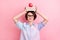 Photo of young woman happy positive smile hold books apple on head balance isolated over pastel color background