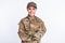 Photo of young woman happy positive smile soldier army officer crossed hands uniform isolated over white color