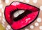 Photo of young woman with professional comic pop art make-up. Creative beauty style. Close up lips