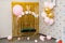 Photo zone for a little Princess: a carriage and balloons on a Golden shiny background. Decor for a child`s birthday