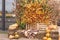 Photo zone outdoor for Halloween. Pumpkins, straw and apples