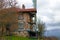 A photograph of an Anatolian Turkish house captured with a view of high forest landscape of the Black Sea region,in Bolu