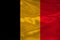 Photograph of the beautiful colored national flag of the modern state of Germany on textured fabric, concept of tourism, economics