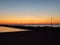 Photograph of the cobalt blue Mediterranean sea against a blazing sky during a sunset from Sicily