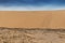 Photograph of dunes with vegetation of the Namibe Desert. Africa. Angola