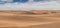 Photograph of dunes with vegetation of the Namibe Desert. Africa. Angola