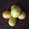 Photograph of five ripe guavas together
