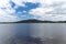 Photograph of a large telecommunications tower on a hill across water