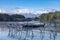 Photograph of mountains and flood waters at the Manapouri Boat Club in New Zealand