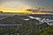 Photograph of the Penha Convent at sunset, also showing the cities of Vila Velha, Vitoria and the Third Bridge