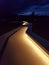 Photograph of the reproduction path of the Lascaux Cave illuminated at night