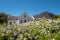 Photograph of the restored whitewashed, gabled Dutch Reformed Church in the main street in Franschhoek, South Africa