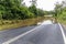 Photograph of a river flooding across a road in regional Australia