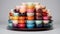 Photograph a stack of colorful tea cups with matching saucers, arranged neatly agains