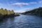 Photograph the Waiau River from the Kepler Track swing bridge while driving from Te Anau to Manapouri in New Zealand