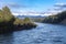 Photograph the Waiau River from the Kepler Track swing bridge while driving from Te Anau to Manapouri in New Zealand