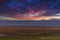 Photograph of Wind Turbines during a cloudy sunset on a hill in Australia