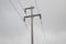 Photograph of a wooden powerline pole and wires