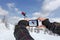 Photographed skiers jump with smart phone