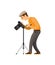 Photographer Adjusting Digital Camera on Tripod