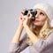 Photographer. Beautiful blonde young woman taking photo