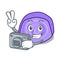 Photographer blueberry roll cake mascot cartoon