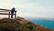 A photographer captures a dramatic coastal vista at on outlook of Big Sur