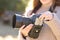 Photographer changing battery on dslr camera