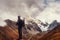 Photographer on cliff. Nature takes photos with mirror camera peak of rock.