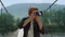 Photographer enjoy mountains nature closeup. Joyful tourist take photo on camera