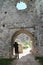 Photographer in entrance to ruins of Tematin castle