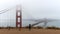 Photographer on foggy morning at the Golden Gate