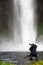 Photographer in front of Seljalandsfoss waterfall