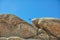 Photographer guy jumping over rocks.